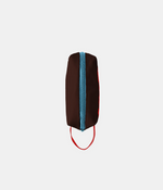 A dark brown zippered pouch with a vertical light blue zipper down the center and a red hanging loop at the bottom, shown on a plain light gray background.
