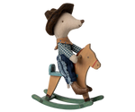 Toy mouse in cowboy outfit riding a wooden horse on a white background