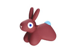 Red rabbit-like figurine with a blue tuft of hair on a white background
