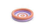 A purple and orange inflatable pool on a white background