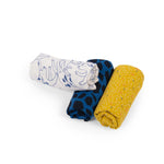 Three folded fabrics with different patterns on a white background