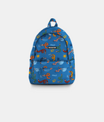 A blue backpack with a colorful cartoon twisty pencils pattern, featuring a front zip pocket and a top handle, shown against a light gray background.