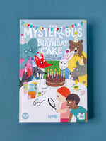 Children's puzzle box with illustrated animals all around a chocolate cake  entitled 'The Mysterious Case of the Birthday Cake' on a blue background