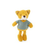 a gold-coloured plush fox wearing a blue t-shirt on a white background.