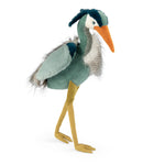 Stuffed toy heron with a green body, gray wings, and orange beak on a white background