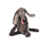 Brown, scruffy dog with long ears and limbs on a white background