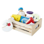 Toy food items in a wooden crate with 'Le Toy Van' branding on a white background