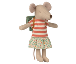 Stuffed mouse toy wearing a striped dress and holding a book on a white background