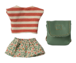 Striped shirt, floral skirt, and green pouch on a white background