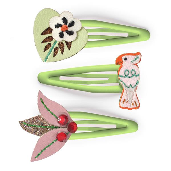 on a white background, 3 green epoxy coated hair clips with felt and fabric decorations on the ends