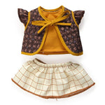 Children's outfit with floral jacket and checkered skirt on a white background