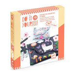 Packaging of a craft kit with cartoon designs and text 'Do It Yourself' on a white background.