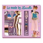 On a white background, a purple craft box that says "la mode by lucille" in blue script. illustrated dolls with various outfits are featured on the front. 