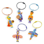 Set of colorful pixelated character keychains on white background