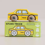 Yellow toy taxi car on top of its packaging box with 'GT245 TRIXIE' branding.