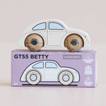 White wooden toy car with wooden wheels on top of its lavender packaging box, which has 'GT55 Betty' branding.