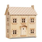On a white background, a natural wood dollhouse with windows, shutters and a door that opens and closes.