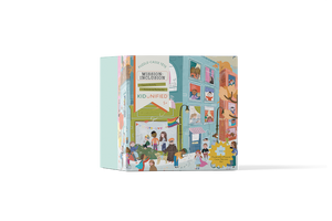 The Square puzzle box at an angle. Box is illustrated with soft colours showing lots of kids of different colours and abilities on a street in front of an apartment building and in the windows of the apartment building.