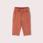 Red pants with white pin-stripes pants on a light gray background