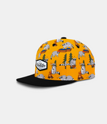 A snapback cap in a bright yellow-orange covered in a raccoon-themed outdoor pattern, featuring a solid black flat brim and a white 'headster' patch on the side, set against a light gray background.