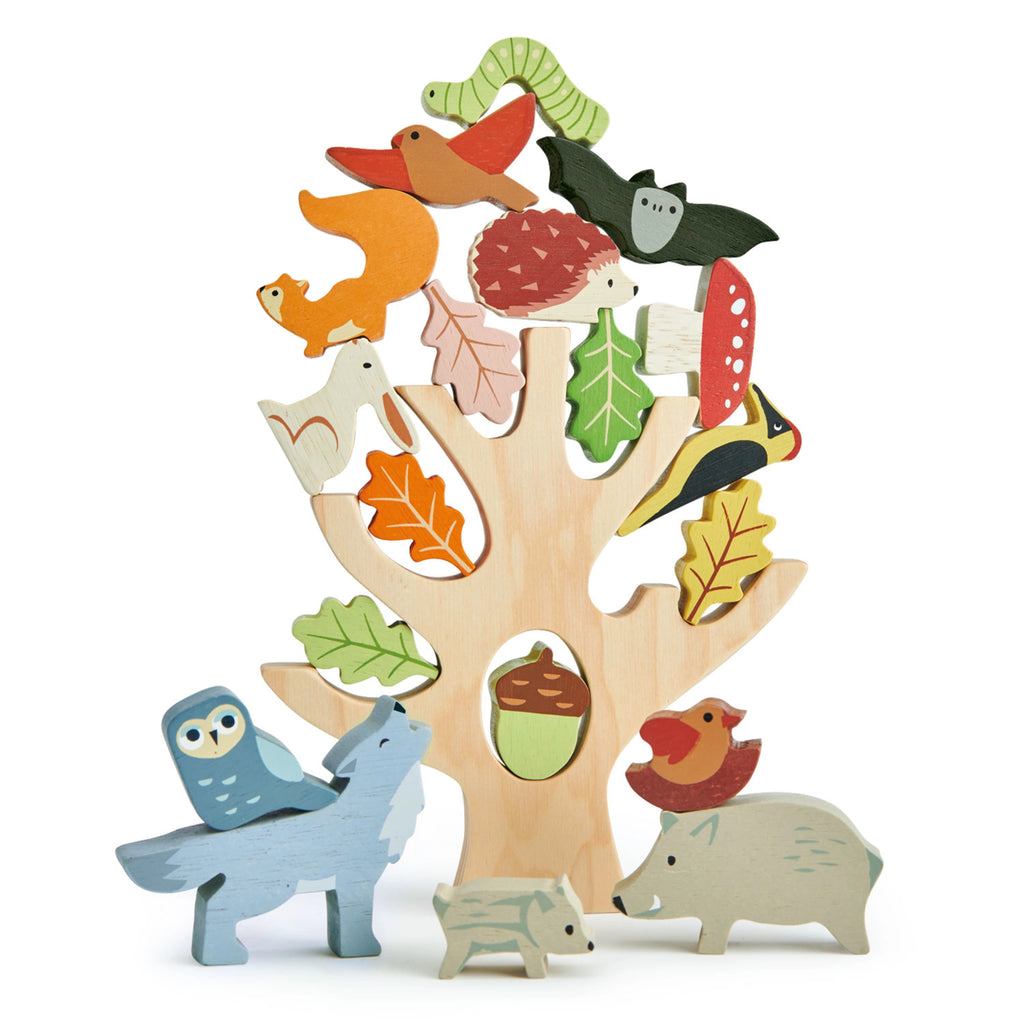 Wooden tree with animal figures and nature elements on a white background