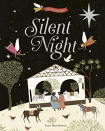 The cover of "silent night" Black sky with  a white 8 point star, angels around the title and a couple holding a baby in a barn with animals around.