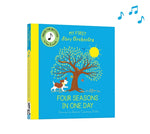 On a white background, a bright blue book with yellow spine. An illustrated tree is on the front with a brown and white dog underneath, a yellow sun in the corner.