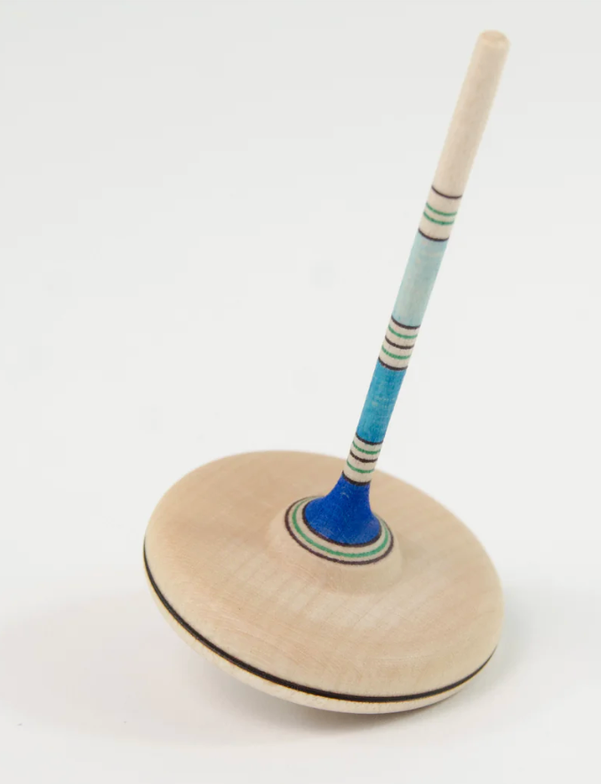 wooden top with round base and long, skinny handle. Natural colour with blue stripes and lines in varying widths on the handle
