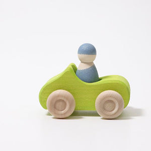 Small Green wooden Convertible Car with a blue wooden peg doll inside on a white background.
