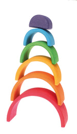 6 wooden rainbow arcs stacked on top of each other, the largest red arc at the bottom then each smaller arc in succession until the top solid purple piece at the top. Featured on a white background.