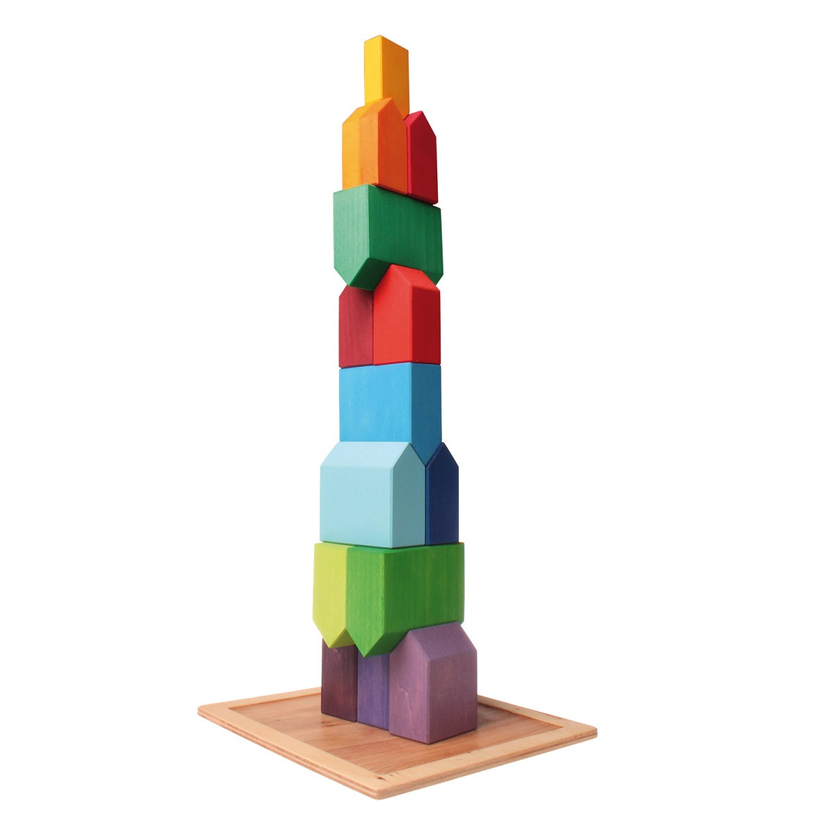 on a white background, a natural wooden square tray, with multi coloured houses stacked on top of each other into a tall tower.