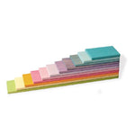 on a white background, a set of wooden planks in pastel colours stacked on top of each other from largest to smallest