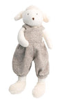 A plush sheep on a white background dressed in dressed in light brown baggy tweed overalls.