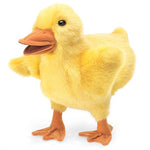 Yellow plush duckling with orange beak and legs on a white backgroundn