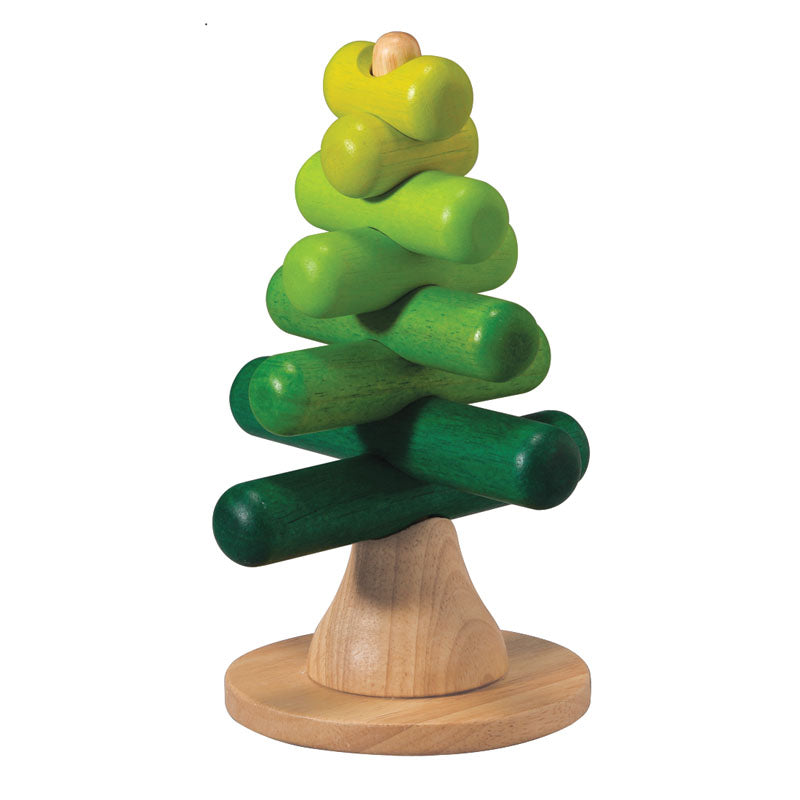 A wooden base holds perpendicular sticks in a green ombre on a white background.