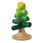 A wooden base holds perpendicular sticks in a green ombre on a white background.