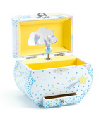 A light blue music box with blue and yellow stars all over it on a white background. The top is open, showing a small unicorn sitting on a cloud.