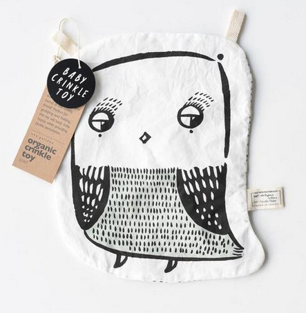 on a white background, a black and white graphic drawing of an owl on a thin white fabric with two cotton twill tabs at the top.
