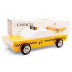 on a white background, a wooden yellow checkered cab with its box behind it