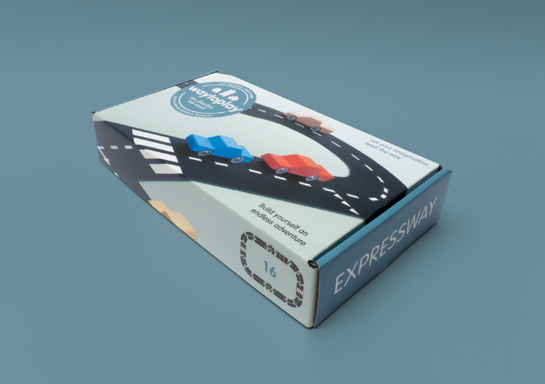 on a blue background that matches a blue box of the featured expressway set. Box shows roadway and cars on it.